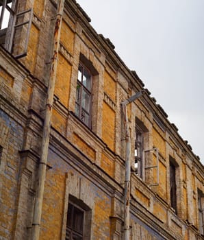Old abandoned building wall with cloudy sky. Kiev, Ukraine