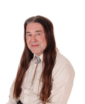 A handsome indigenous man smiling in a portrait shoot with his.long brunette hair, isolated for white background.