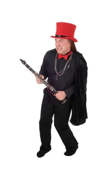 A indigenous man in a black shirt and pants and red hat dancing with.his clarinet in his hand, isolated for white background.