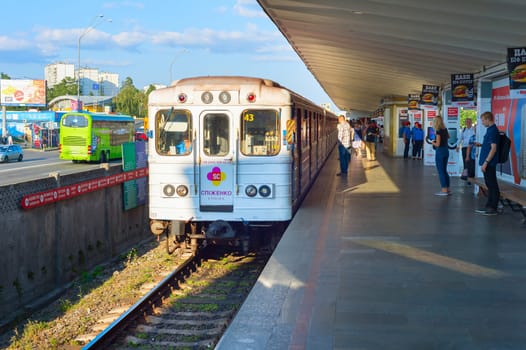 KIEV, UKRAINE - SEPTEMBER 06, 2019: People waiting for arriving metro train at underground station platform in Kiev. Kiev is the capital of Ukraine