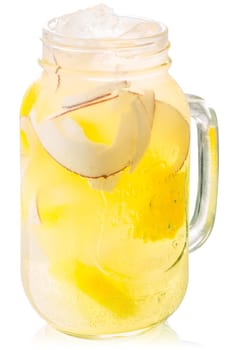 Pineapple coconut drink or iced lemonade in a mason jar, isolated