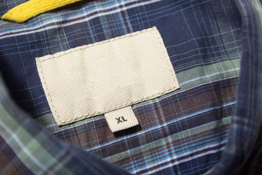 Empty label on a blue men's shirt