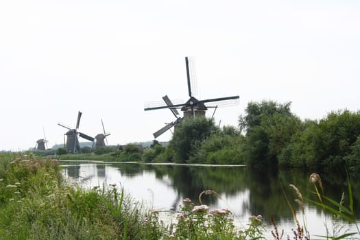 A beautiful, old, historic windmill, with four wings
