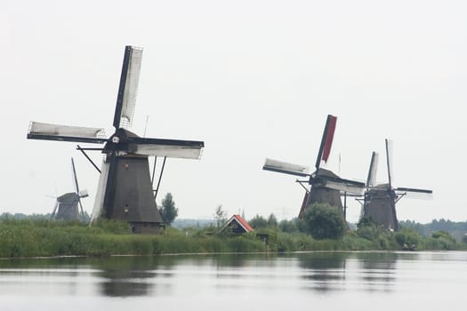 A beautiful, old, historic windmill, with four wings