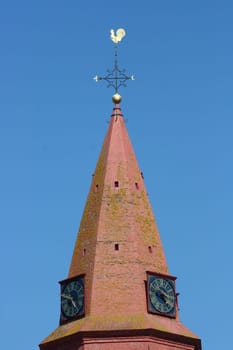 Red Tower with blue sky in the background