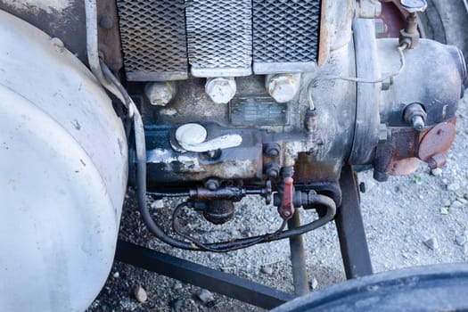 Close up of the motor area of an old farm tractor