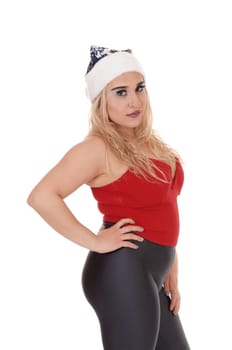 Beautiful blond woman in a close-up image in a red top and a blue.Santa hat, serious, isolated for white background.