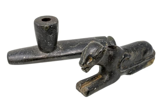 Two Pipes of the North American Indians made of dark soapstone isolated on white