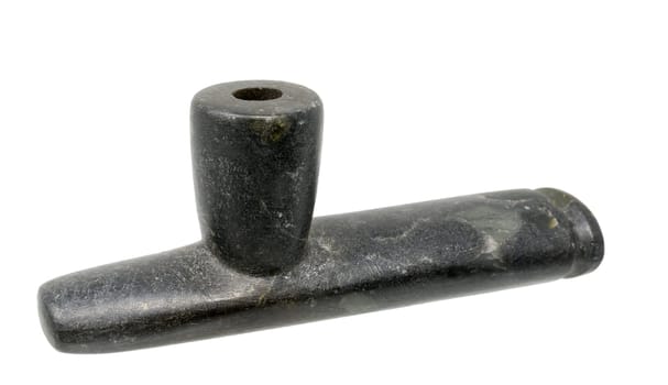Pipe of the North American Indians made of dark soapstone isolated on white
