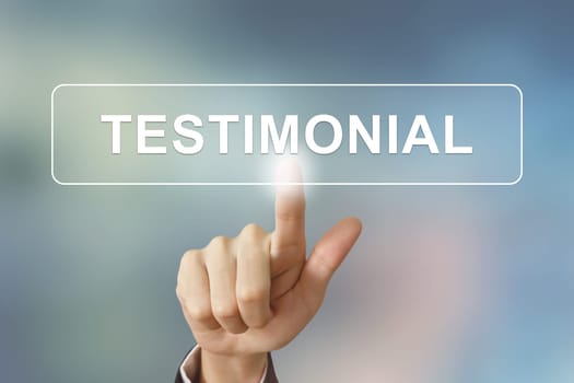 business hand pushing testimonial button on blurred background