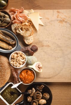Food Concept - Various Spanish Tapas on Wooden Table with Copy Space