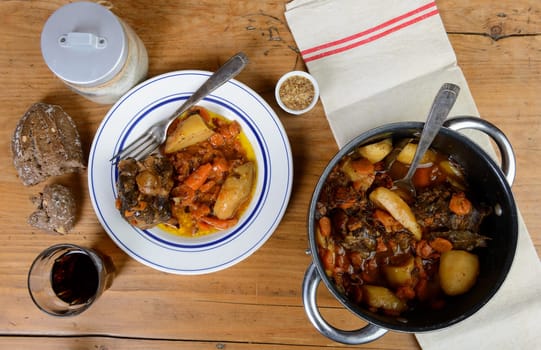 beef dish with carrots on the old table