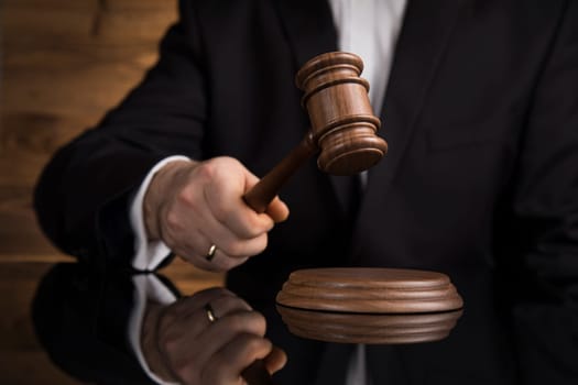 Judge, male judge in a courtroom striking the gavel