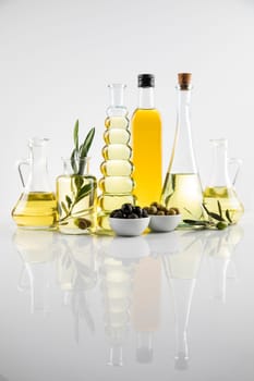 Olive oil bottles, olive branch and Cooking oils