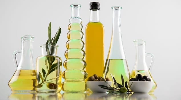 Olive oil bottles, olive branch and Cooking oils