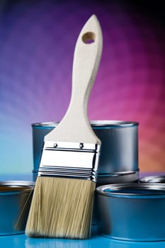 Tin metal cans with color paint and paintbrush