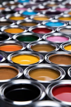 Group of tin metal cans with color paint