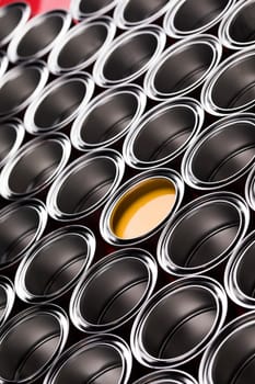 reativity concept group of tin metal cans with color paint