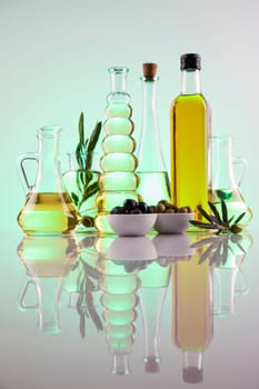 Olive oil bottles, olive branch and Cooking oils