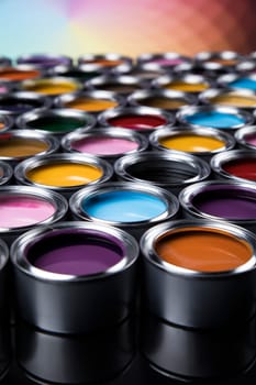 Group of tin metal cans with color paint