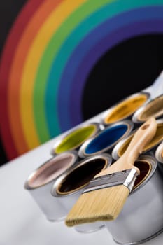 Paint can with a paintbrush