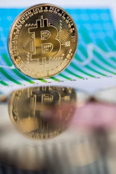 Golden Bitcoin Coin, virtual money, financial chart