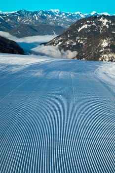 Winter mountains panorama with ski slope