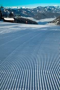 Winter mountains panorama with ski slope