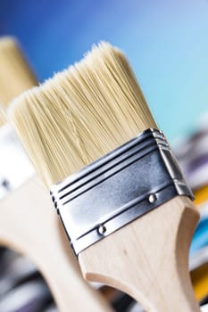 Metal tin cans with color paint and paintbrush