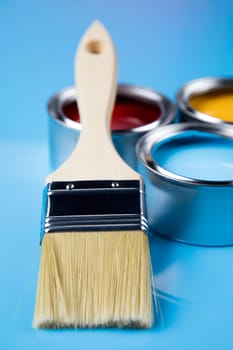 Paint can with a paintbrush