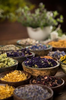 Natural remedy and wooden table background