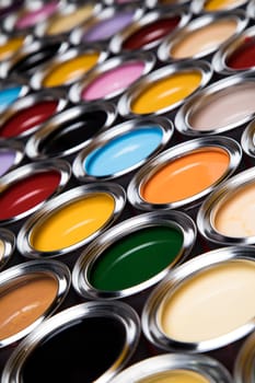 reativity concept group of tin metal cans with color paint