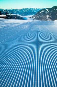 Winter mountains panorama with ski slope