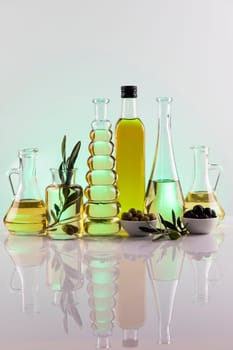 Bottles of olive oil, olive branch and Cooking oils