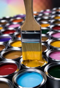 Paint can with a paintbrush