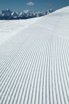 Winter mountains panorama with ski slope