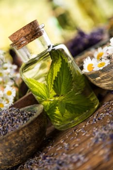 Oil and Natural medicine, wooden table background