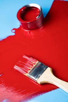 Tin metal cans with color paint and paintbrush