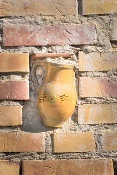 Partly in walled ceramic jug as outdoor advertisment of a pottery