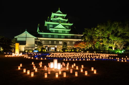 Night illumination with Japanese lanterns of Okayama castle or Crow castle in Okayama, Japan