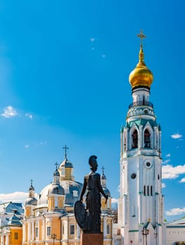 Old Vologda Kremlin and church in northern Russia, Europe. Ancient fortress with while walls, towers and blue cloudy sky in background