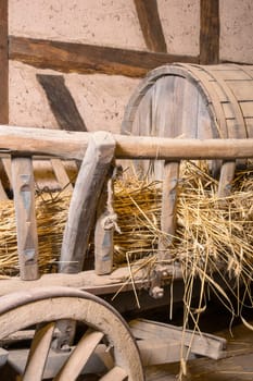 Old hay wagon with a slurry tanker on a layer of straw
