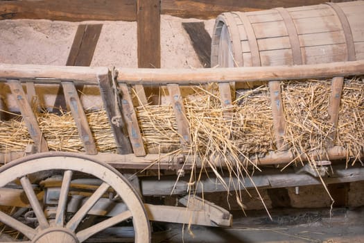 Old hay wagon with a slurry tanker on a layer of straw