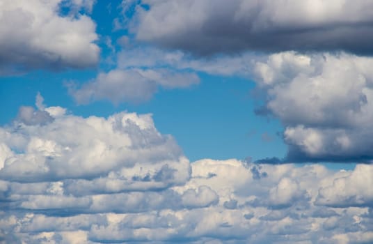 heavenly sky between the white clouds and the radiant sun