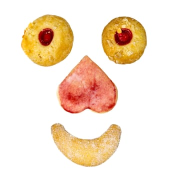Face made of homemade Christmas cookies biscuits isolated on white