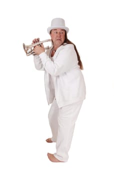 A middle age indigenous man standing in a white outfit and white hat.holding his trumpet looking back, isolated for white background.