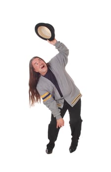 An indigenous man in a gray jacket and long brunette hair dancing .with his black hat, isolated for white background.