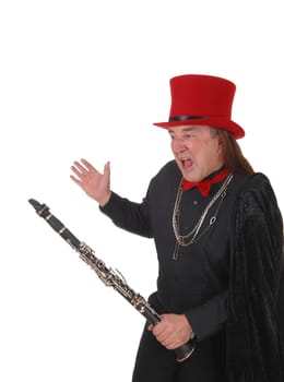 A middle age indigenous man holding his clarinet in a black outfit and.red hat and bow tie, shouting, isolated for white background.