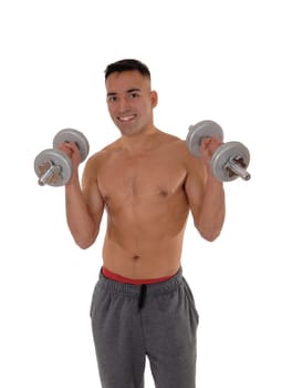 A east Indian man working out wit two dumbbells shirtless in his.track pants and red underwear, isolated for white background.