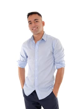 A handsome east Indian man standing in dress pants and a blue shirt.relaxed in the studio, smiling, isolated for white background.